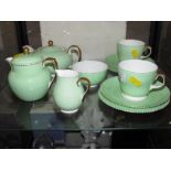 WEDGWOOD BONE CHINA BREAKFAST SET IN PALE GREEN WITH GILT TRIM, COMPRISING TWO SIDE PLATES, TWO