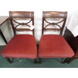 Two William IV mahogany side chairs with overstuffed red upholstery and turned front legs on later