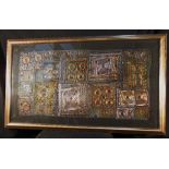 A panel of gold embroidered garment fragments. Framed. 92 x 54