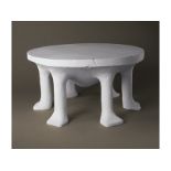 One of an edition of plaster cast tables by John Dickinson 'Six legged African Table' manufactured