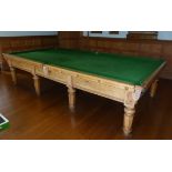 A full sized, light oak Burroughs & Watts billiard table made in 1948 for a Mr Withnail. Some cues