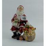 Royal Doulton Seated model of Santa Claus with teddy in arms next to a sack of toys limited edition