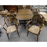 Oak drop leaf table and four matching wheel back chairs inc 2 carvers (5)