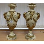 Pair of marble lamp stands with neoclassical rams head decoration