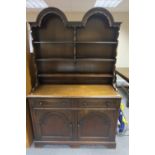 Oak dresser with twin oval topped plate racks