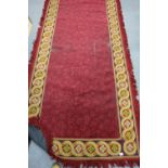 Large Red tapestry edged rug 300cm x 135cm (some wear)