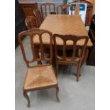 French Carved Oak extending table with parquetry top together with 6 matching rush seated chairs