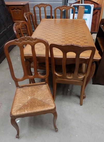 French Carved Oak extending table with parquetry top together with 6 matching rush seated chairs