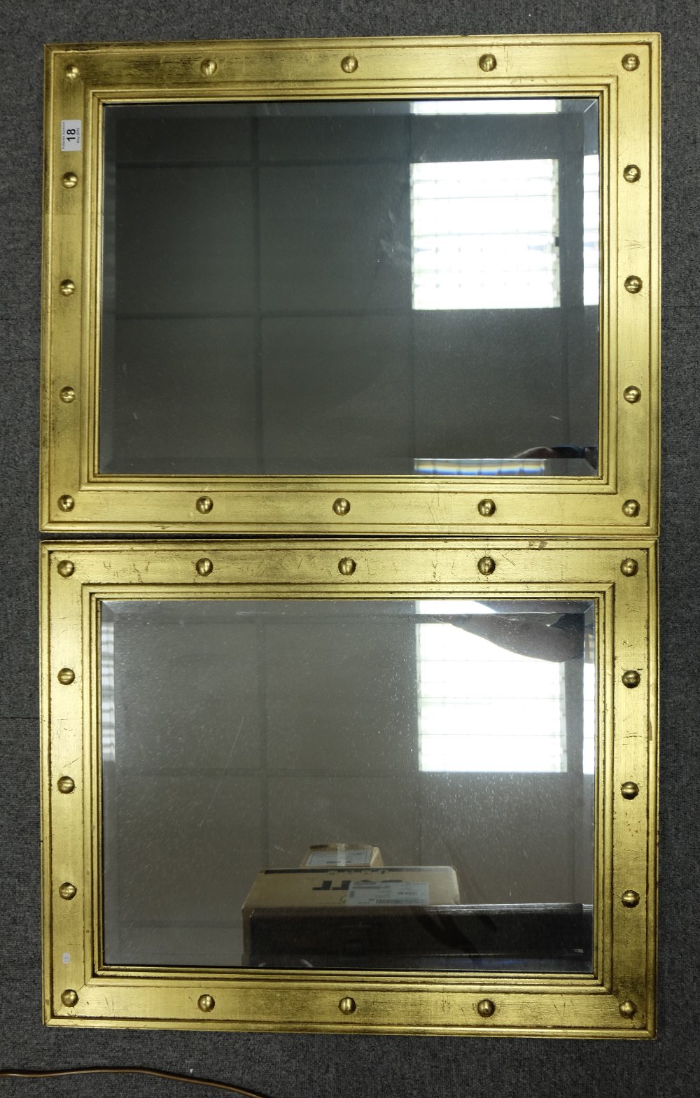 Two framed rectangular beveled edged mirrors with gold painted wooden studded frames (2) 59cm x