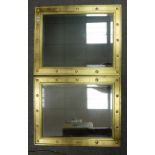 Two framed rectangular beveled edged mirrors with gold painted wooden studded frames (2) 59cm x