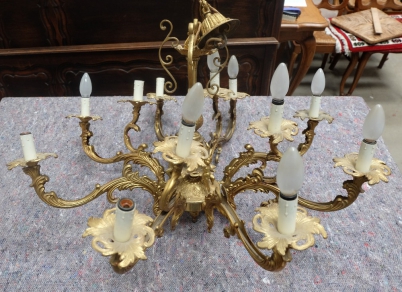 Twentieth century ornate eight branch chandelier decorated with dancing cherubs