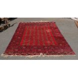 Large decorative carpet in red (wear to tassels) approx 2.