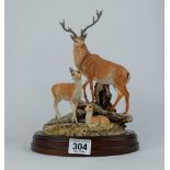 Sherratt and Simpson Deer Family on rock on wooden base