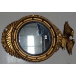 Reproduction gilded port hole mirror with eagle mounted on top