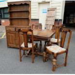 Oak linen fold dresser together with similar draw leaf table and 4 matching chairs (6)