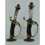 Pair of Reproduction sword handles made into candlesticks