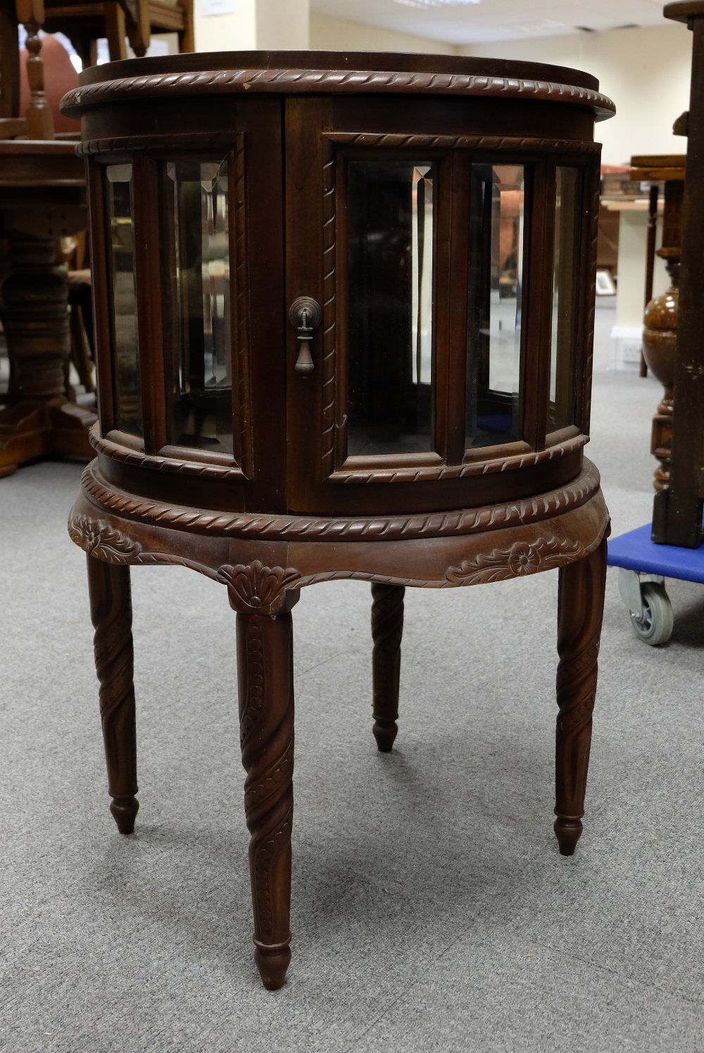 Reproduction mahogany tray top circular display cabinet with glass panels