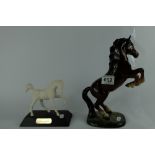 Beswick Rearing Welsh Cob 1014 together with Royal Doulton Springtime foal on wooden base (2)