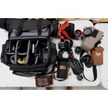 A large collection of SLR camera equipment and associated items to include Pentax cameras, Tokina,