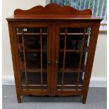 Arts and crafts mahogany glass fronted two door display cabinet