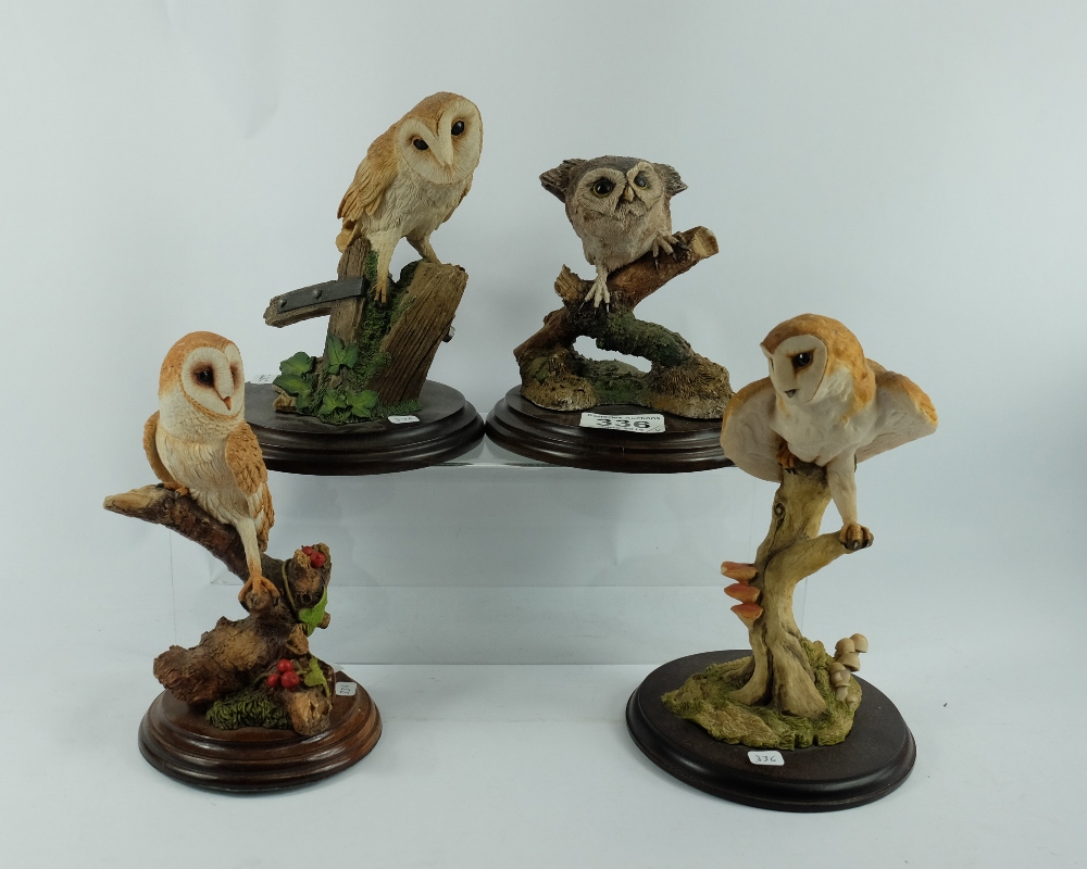 Resin figures of owls on perch (4)