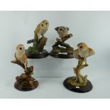 Resin figures of owls on perch (4)