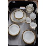 A collection of Minton teaware with gold