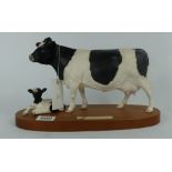 Royal Doulton Frisian Cow and calf on wo