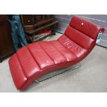 Red leatherette lounger on chrome footing.