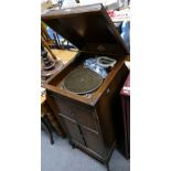 Gilbert free standing gramophone in oak case.