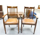 Pair mahogany armchairs with leather seats.