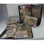 A collection of early world bank notes comprising notes from Brazil, Greece, Ghana, South Africa,