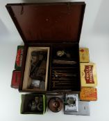 A collection of early fishing tackle including brass and oak reels, boxed Cigna reel,