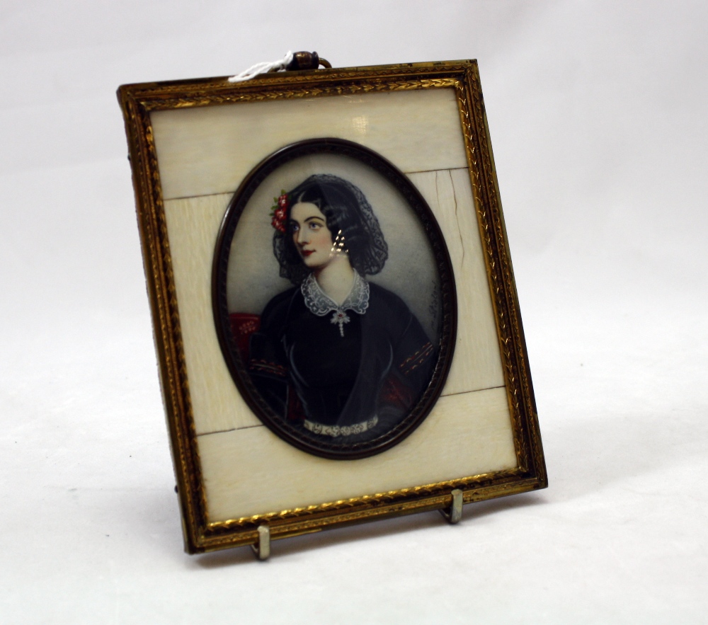 Miniature portrait oval painting of a lady in black dress signed M.