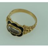 Yellow coloured metal enameled mourning ring total weight 3.