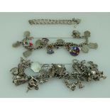 Three silver charm bracelets with assorted charms total weight 131.