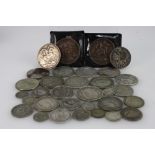 A collection of pre 1947 silver coins including crowns, half crowns, US dollars, florin's,