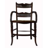 Aesthetic carved walnut spindle back armchair with needlepoint seat