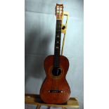 19th Century Parlour guitar labelled Louis Panormo 1826 complete with coffin case