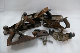 A collection of old wood working planes,