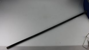 Early 20th Century black wooden walking stick with hall marked silver handle.