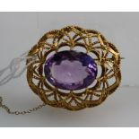 9ct quality gold brooch set with an oval amethyst stone, makers mark BJP (11.