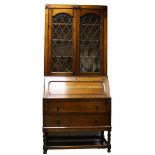 20th Century Moulded Oak Bureau bookcase having twin door glazed upper section