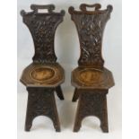 Two Victorian carved oak hall chairs