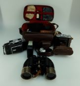 A collection of vintage cameras, binoculars including Zeiss Ikon ,