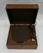 HMV early electric record player in wood cabinet together with a collection of 78's