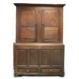 Georgian oak large cupboard, four panel base and two door top,