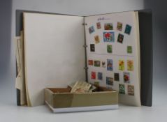 A collection of old world bank notes and a stamp album containing various world stamps