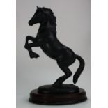 Beswick Welsh Cop Rearing, Model 1014, tail hangs loose on wooden base, issued in Black Matt,