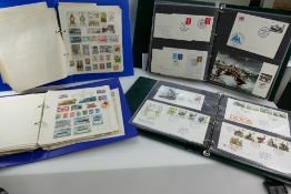 A collection of stamps including early British and World stamps (2 albums) and first day covers (2